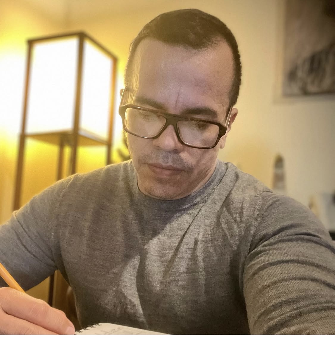 Alberto Barrios sketching at his desk